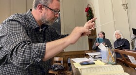 Dr. Richard Waters  conducts a Kentucky Bach Choir rehearsal.