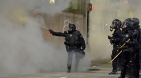 Police shoot pepper spray toward a protester during a demonstration over the death of George Floyd in Boston, Massachusetts, on May 31, 2020. (Joseph Prezioso/AFP via Getty Images)