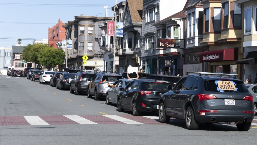 Hundreds of vehicles — by some estimates well more than a thousand — participated in the socially distanced protest. Honking, chanting and shouts filled the streets for hours.