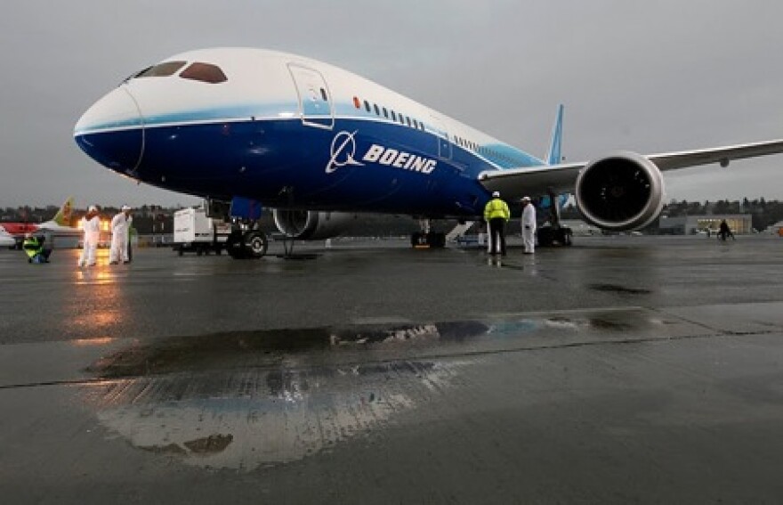 The first production Boeing 787 is seen on the tarmac after its first flight in Seattle, on Tuesday, Dec. 15, 2009. After delays, testing resumes again, a year after first flight.