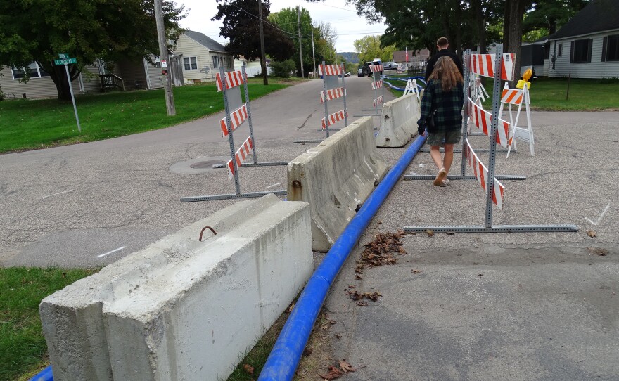 After the water settled, it was pumped out of the dumpster.