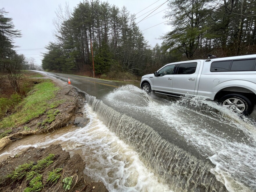 A tributary of the Passagassawakeag River flooding over Head of the Tide Road in Belfast on Monday.