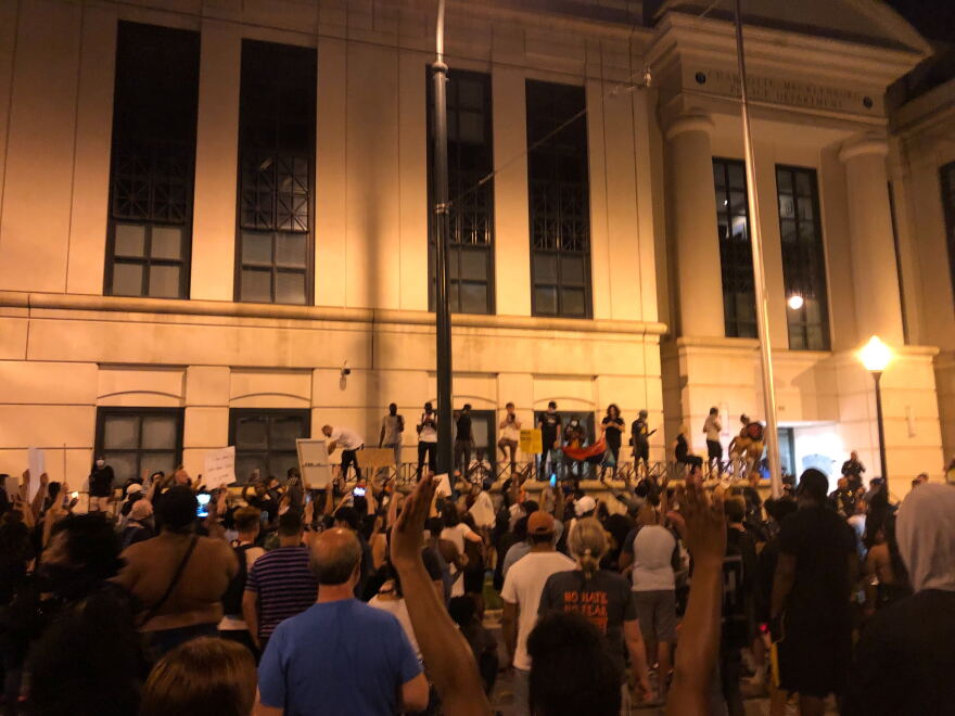 Protesters gathered outside CMPD headquarters in uptown Charlotte. 