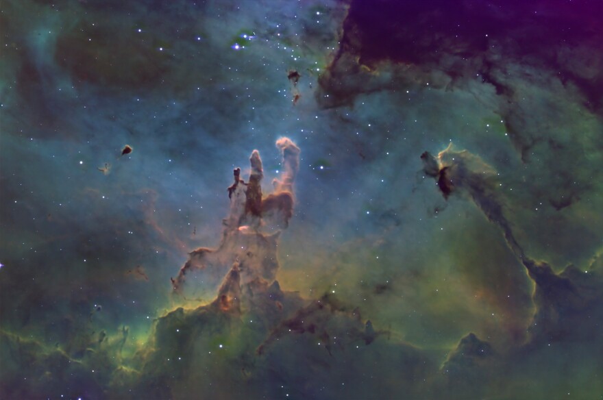 South of Altair is the famed “Pillars of Creation” in the center of the Eagle Nebula, M-16. This superb portrait is by EAAA member James Schultz with a 14” telescope.This region of star birth is a rich mix of condensing dark globules collapsing to make new stars, young blue stars shining so brightly that their stellar winds drive away the gas and dust, and of course leftovers around them condensing into new young planets, some of them rocky like our own Earth. One of the paradoxes of star-forming regions like this is that for such gravitational collapse to begin, the region must be cold, dense, and dark.