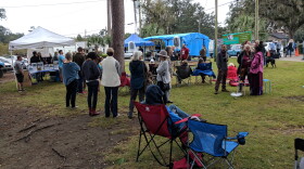 As Sunday's rains abated, the crowds grew at Lake Ella to hear the music and help the food drive.