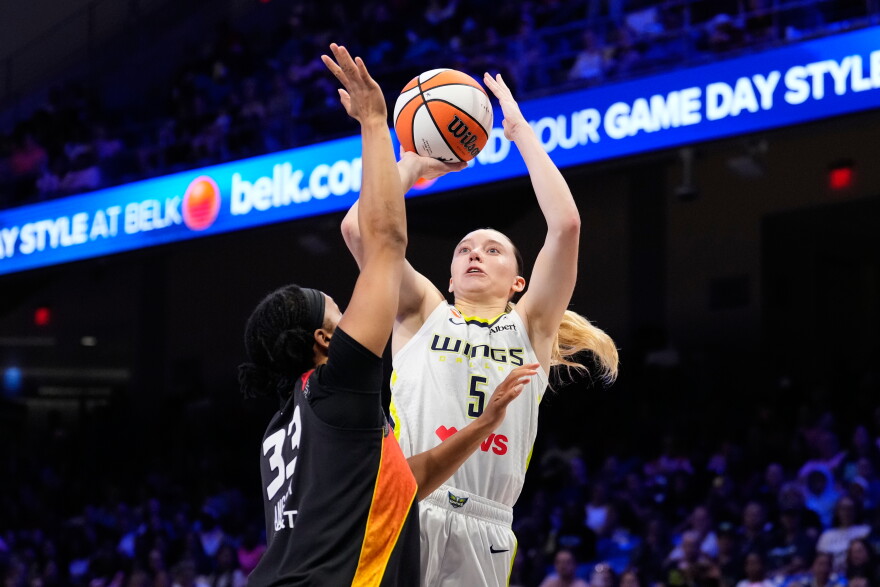 Dallas Wings guard Paige Bueckers (5) shoots as Connecticut Sun's Nell Angloma (33) defends in the first half of a WNBA basketball game Sunday, Aug. 30, 2026, in Arlington.