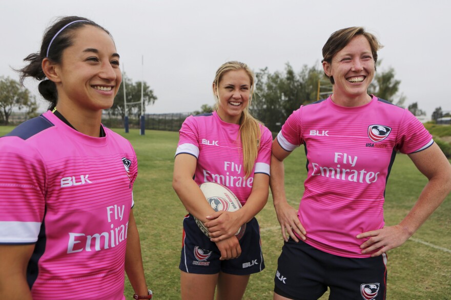 Kelly Griffin (left), Richelle Stephens and Jillion Potter stand together during practice.