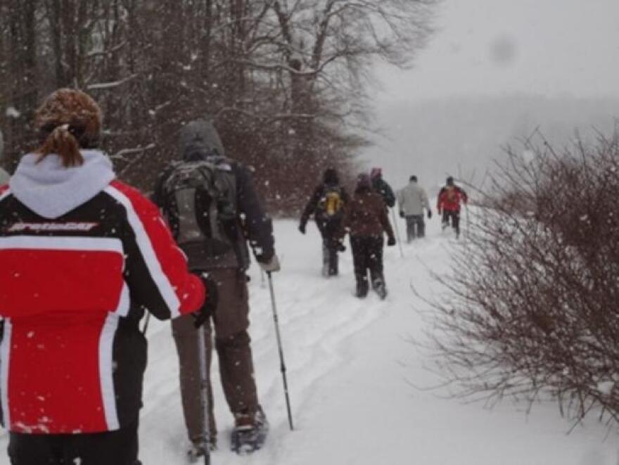 Snowshoeing_people_walking_on_trail.jpg