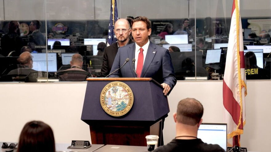 Ron DeSantis speaking at a podium