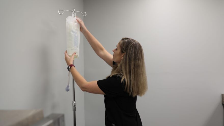 Ashley Powell prepares an exam room before Ally Urgent Care opens. (Photo: Laura Philion)