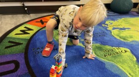 A boy plays at the recently renovated Y Academy Preschool in southwest Denver, one of hundreds of Colorado preschools that will offer universal preschool in the fall.