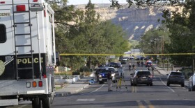 Investigators work along a residential street following a deadly shooting Monday, May 15, 2023, in Farmington, N.M. Authorities said an 18-year-old opened fire in the northwestern New Mexico community, killing multiple people and injuring others, before law enforcement fatally shot the suspect. (AP Photo/Susan Montoya Bryan)