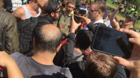 Counter-protesters surround a man who was trying to approach the Parkman Bandstand in Boston, on Aug. 19, 2017.