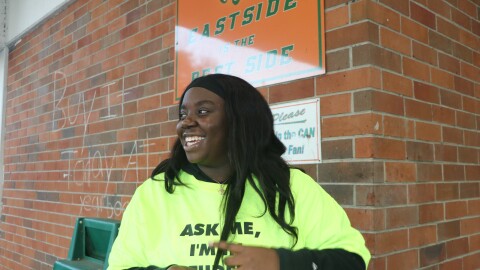 Davis laughs and smiles as she volunteers at Eastside High School after school hours. She warmly welcomes residents to campus wearing a shirt that says, “Ask me, I’m in student government.”