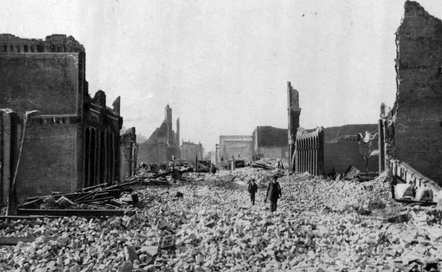 People walk through the rubble following the earthquake in San Francisco.