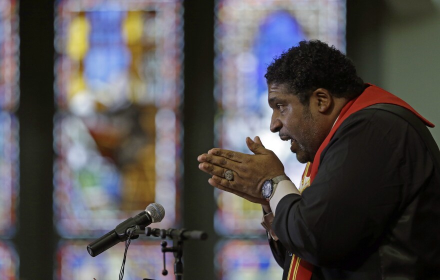 In this Wednesday, June 24, 2015 file photo, Rev. William Barber, president of the state chapter of the NAACP and architect of the protests known as "Moral Monday, speaks during a Bible study at Pullen Memorial Baptist Church in Raleigh, N.C. 