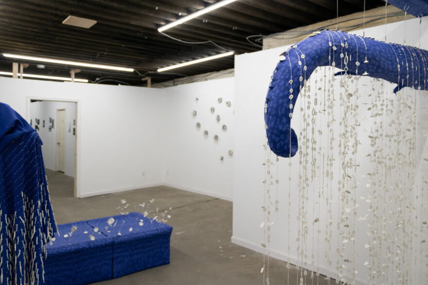 “The Forest Whispers to Me” by Ellie Naege is on display at The Waiting Room.