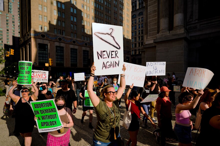 Protestors in the streets with signs. 