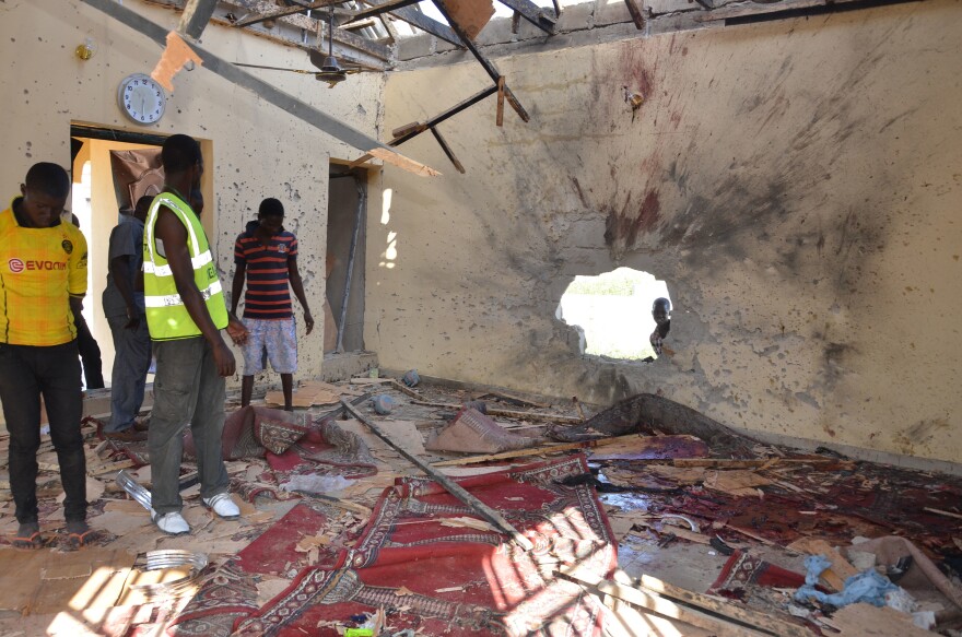 People inspect a damaged mosque following an October 2015 explosion in Maiduguri, Nigeria. Maiduguri is in Borno State, where Boko Haram was born.