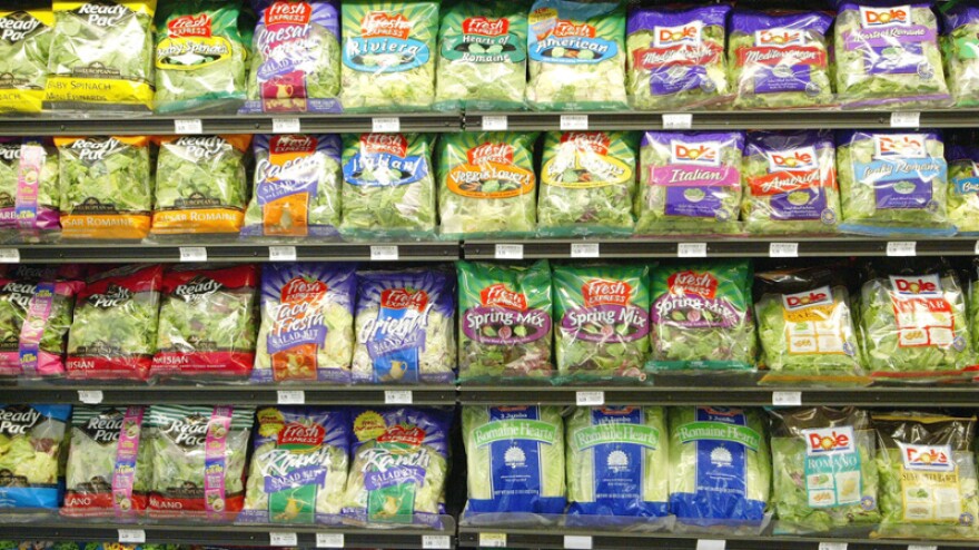 Packaged salads sit on the shelves of a Bell Market grocery store in San Francisco in 2003. Hundreds of recent salad products from Dole and Fresh Express have been recalled because of listeria concerns.
