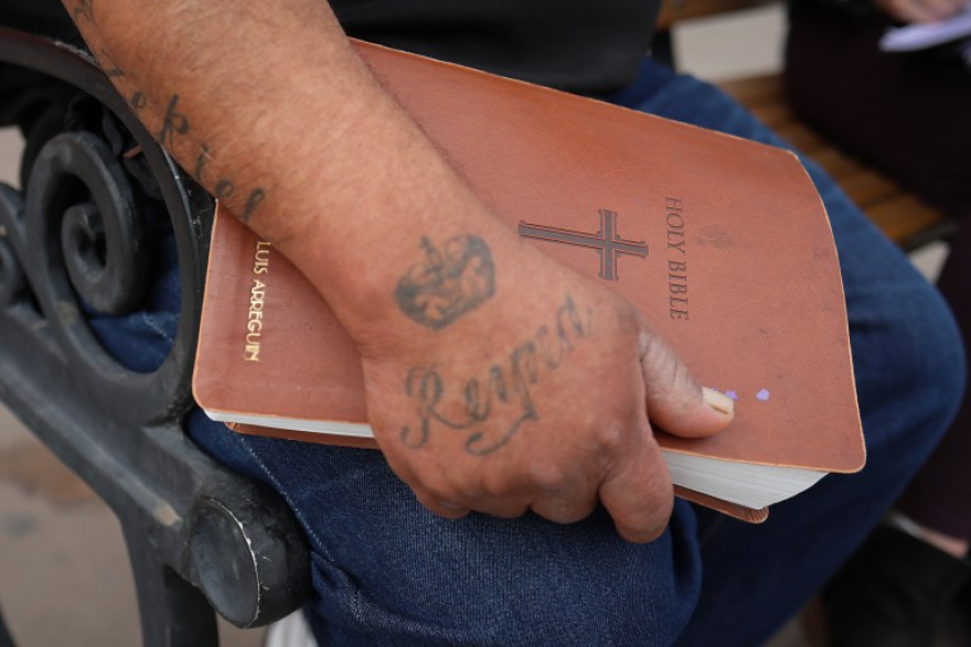 Luis Arreguin holds his Bible.
