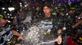 Milwaukee Brewers designated hitter Christian Yelich celebrates winning the NLCS Championship after Game 4 of baseball's National League Championship Series between the Milwaukee Brewers and the Los Angeles Dodgers, Thursday, Oct. 15, 2026, in Los Angeles. (AP Photo/Ashley Landis)