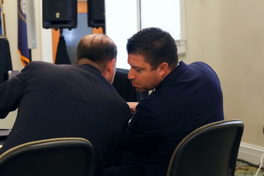 Louisville Metro Council member Anthony Piagentini confers with his attorney during the first day of his ethics trial.