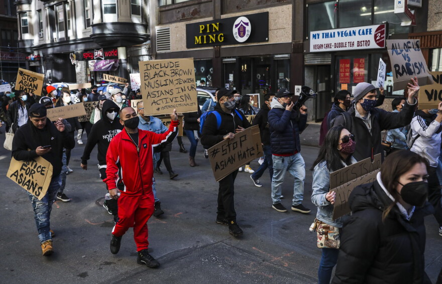 Hundreds marched through Chinatown en route to the State House during a "Stop Asian Hate" rally in Boston on March 13. (Erin Clark/The Boston Globe via Getty Images)