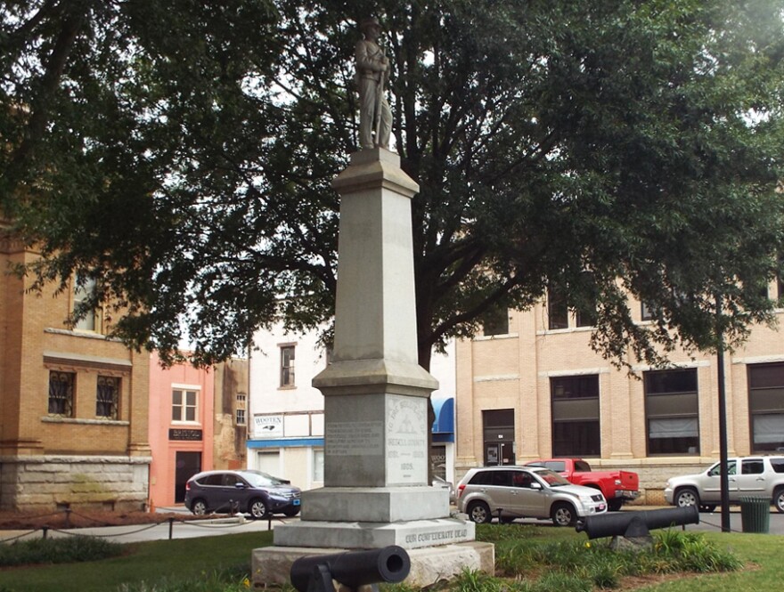 The Confederate monument in Statesville depicts a Confederate soldier standing at parade rest while holding a musket.
