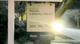 A for sale sign hangs outside a Miami-Dade house in February 2026.