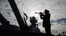Greg Murphy plays the Navy Hymn during a ceremony commemorating the 75th anniversary of the Dec. 7, 1941 Japanese attack on Pearl Harbor, on board The Battleship New Jersey Museum and Memorial in Camden, N.J., Wednesday, Dec. 7, 2016. (Matt Rourke/AP Photo)