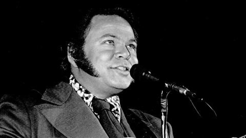 Roy Clark plays guitar in an undated photo.