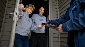 Retired couple Annette Williams, and her husband, Curtis Williams, speak with Indiana state Sen. Spencer Deery, R-West Lafayette, who represents District 23, after he stops at their home while canvassing a neighborhood, Saturday, April 11, 2026, in West Lafayette, Ind.