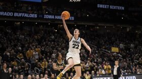Iowa guard Caitlin Clark (22) goes up for a layup.