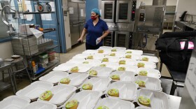 One of this year’s ballot measures is Proposition FF, which would fund free school lunches at Colorado’s public schools. Norma Ordonez prepares take-away lunches for students kept out of class because of the coronavirus at Richard Castro Elementary School early Friday, Dec. 18, 2020, in west Denver.