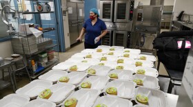 One of this year’s ballot measures is Proposition FF, which would fund free school lunches at Colorado’s public schools. Norma Ordonez prepares take-away lunches for students kept out of class because of the coronavirus at Richard Castro Elementary School early Friday, Dec. 18, 2020, in west Denver. 