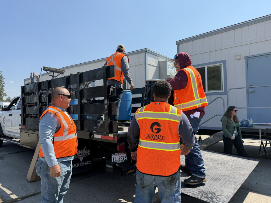 Hazmat crews from GrayMar from Mead, Wash., are cleaning up hazardous household materials after the Spokane Complex fires.