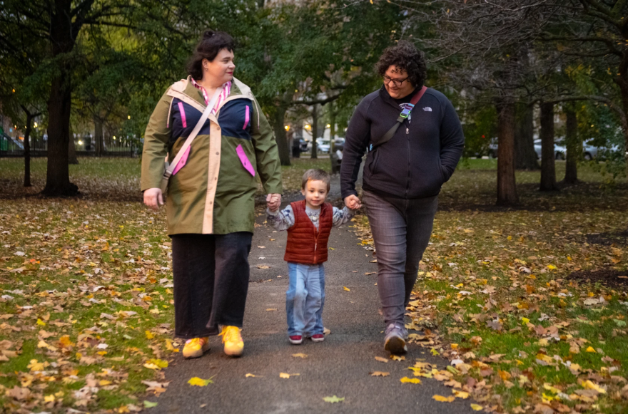 Kris Lantzy (left), their 3-year-old son Archie and Tia Lantzy walk near Cummings Playground in Lincoln Park on the North side last Thursday.