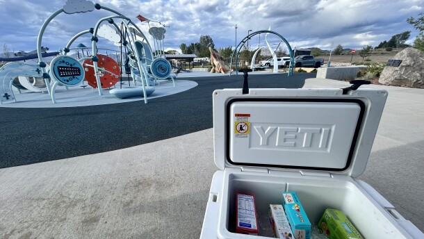 A cooler of popsicles sits by the play structure at Birch Bark Playground in Rifle during a meet-and-greet event with Every Child Parachute to Aspen executive director Samantha Markovitz on Aug. 18, 2026.