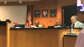 (From left) Newberry City Commissioner Jason McGehee, Mayor Bill Conrad, City Attorney Scott Walker and City Manager Mike New at Monday's commission meeting. Commissioners voted 3-1 at the meeting to delay allow dispensaries in the city by six months. (Amy Nelson/WUFT News)