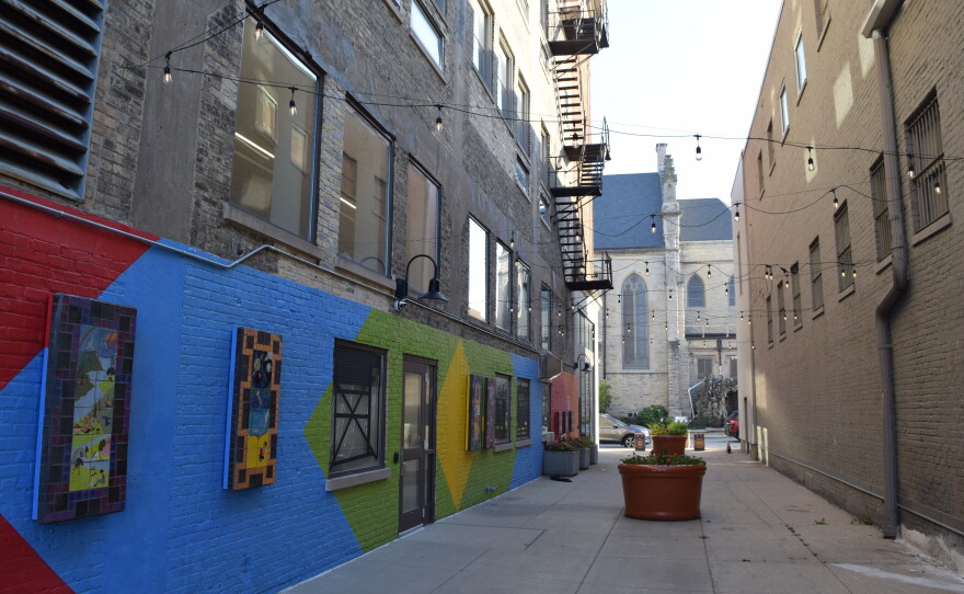 Without access to a typical green space, the alley next to the Mitchell Street Branch was made into a welcoming outdoor space.