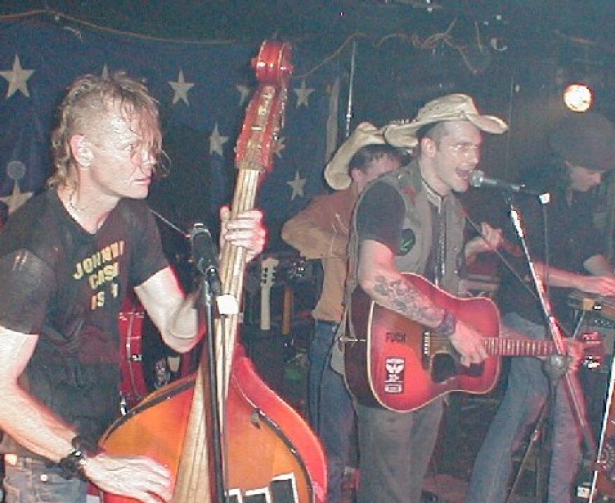 Hank III performs in Birmingham, Alabama. Also pictured is bassist Joe Buck.