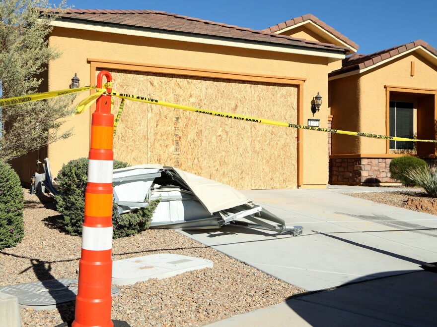 Remains of the garage door sit in the driveway at the house where Las Vegas gunman Stephen Paddock lived in the Sun City community in Mesquite, Nev.