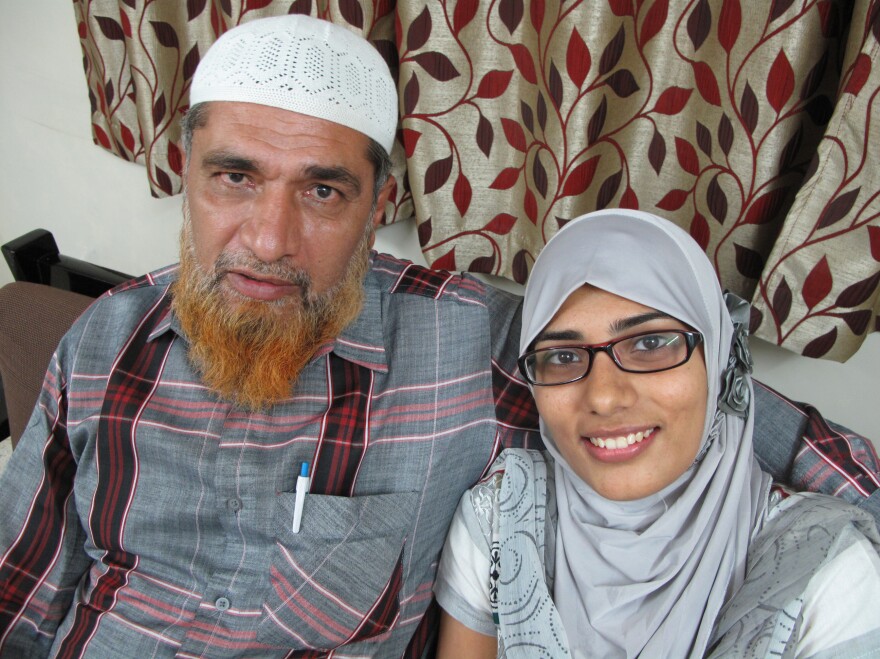 Shaken by the reaction to his daughter's Facebook post, Farooq Dhada (shown here with Shaheen) says in India, freedom of speech "exists only on paper."