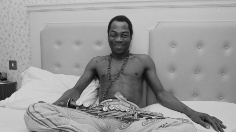 Nigerian multi-instrumentalist, musician, composer, and pioneer of the Afrobeat music genre Fela Kuti (1938 - 1997) in an hotel room, UK, 6th January 1984. (Photo by Mike Moore/Daily Express/Hulton Archive/Getty Images)