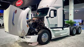 A white Peterbilt 579EV electric semi-truck cab sits on the showroom floor at the 2025 Advanced Clean Transportation Expo in Anaheim, California. Peterbilt is a subsidiary of PACCAR, a Washington-based manufacturer of heavy-duty trucks.