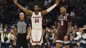 Alabama forward Brandon Miller (24) reacts as Texas A&M guard Dexter Dennis (0) looks on in the final minutes of an NCAA college basketball game in the finals of the Southeastern Conference Tournament, Sunday, March 12, 2023, in Nashville, Tenn. (AP Photo/John Amis)