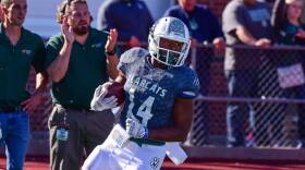 Action shot of Jordon Thompson during football game