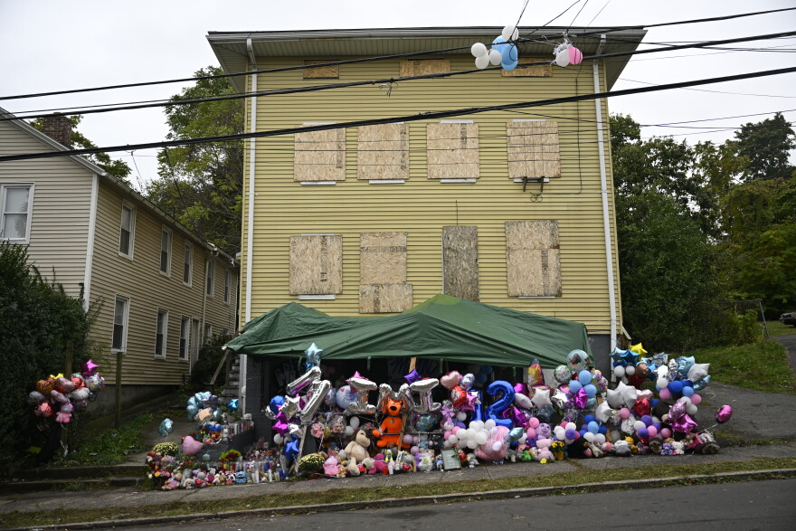 FILE: A memorial stretches along the front of the abandoned home in New Britain where the remains of Jacqueline “Mimi” Torres Garcia were found in October 2025.