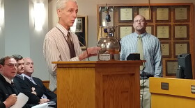 Brad Miller of Environmental Services shows off a cannister used to collect air samples.